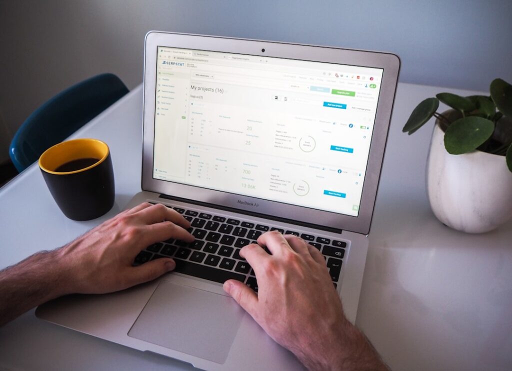 Professional typing email on laptop computer for business outreach and podcast pitch communication